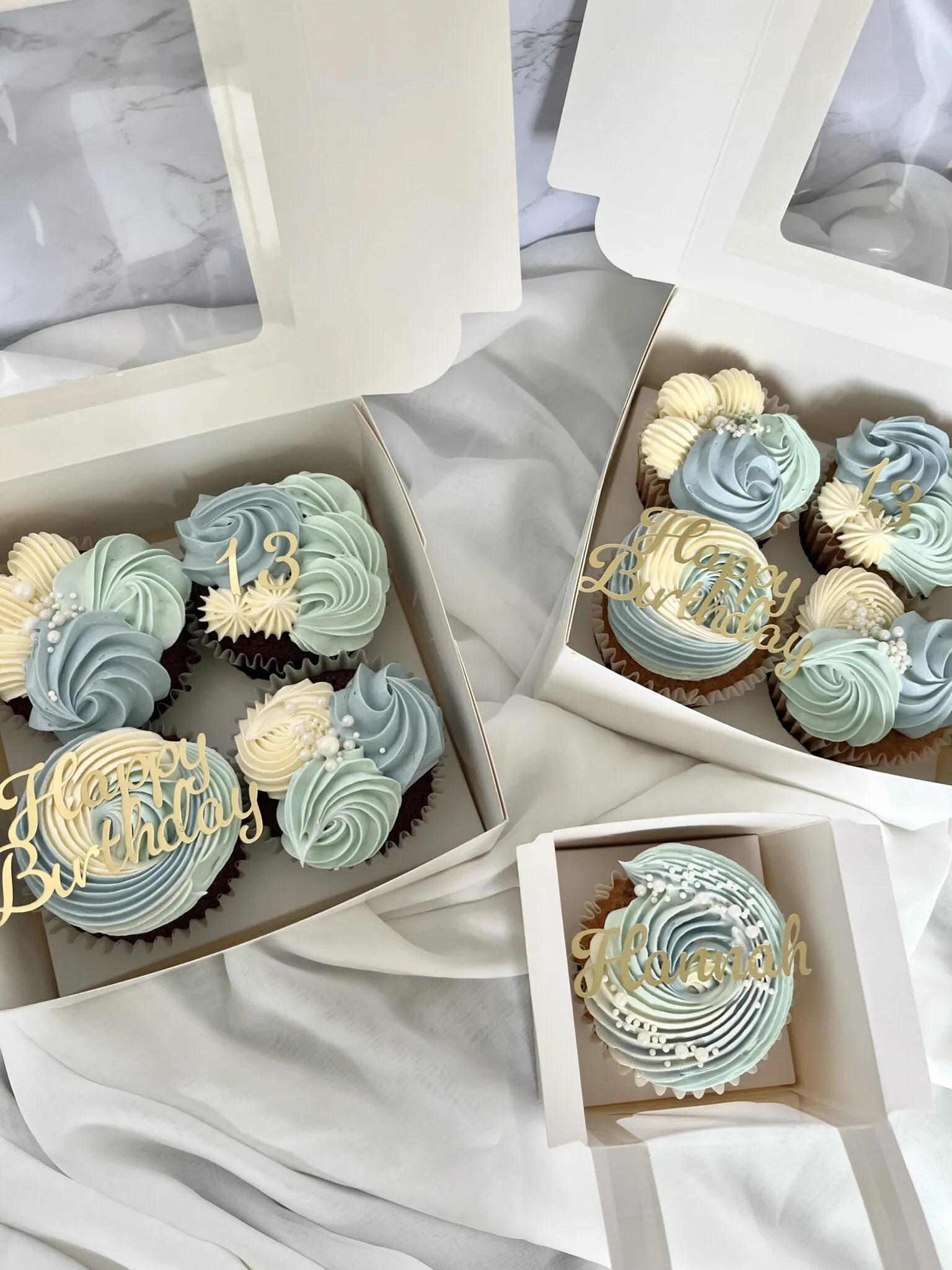 White and blue birthday cupcakes